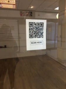 - an example of QR codes used for advertising a business in Lincoln High street, taken 20th March 2015